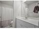 Bathroom features a vanity with a sink, a large mirror, and a shower with a patterned curtain at 602 Jancus St, Charleston, SC 29414
