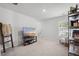 Bright bedroom featuring a TV, a bookshelf, a comfortable rocking chair and neutral decor at 602 Jancus St, Charleston, SC 29414