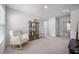 Neutral bedroom featuring a comfortable rocking chair, a bookshelf, and ample closet space at 602 Jancus St, Charleston, SC 29414