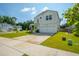 Charming two-story home with a well-manicured front yard, American flag, and attached garage at 602 Jancus St, Charleston, SC 29414