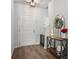 Warm and inviting foyer with wood flooring, a decorative table with a wreath, and a view of the staircase at 602 Jancus St, Charleston, SC 29414