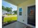 Welcoming front porch featuring stylish decor, a charming wreath, and a glimpse of the lovely neighborhood at 602 Jancus St, Charleston, SC 29414