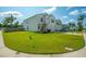 Charming two-story home with a well-manicured front yard, American flag, and attached garage at 602 Jancus St, Charleston, SC 29414