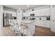 Stylish kitchen with white cabinets, granite countertops, stainless steel appliances, and a large kitchen island at 602 Jancus St, Charleston, SC 29414