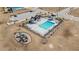 View of the community pool area with plenty of lounge chairs, tables, and a playground for Gathering fun and relaxation at 624 Sienna Way, Summerville, SC 29486