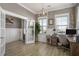 Bright office space with a rustic desk, wood floors, wainscotting and plenty of natural light at 624 Sienna Way, Summerville, SC 29486