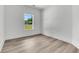 Bright bedroom features modern trim, windows with natural light, and light wood flooring at 6513 Highway 162, Hollywood, SC 29449