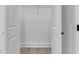 Walk-in closet with installed shelving and light wood flooring at 6513 Highway 162, Hollywood, SC 29449