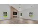Spacious living room with a modern fireplace, recessed lighting, and large windows offering natural light at 6513 Highway 162, Hollywood, SC 29449