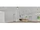 Bright open living space with kitchen view, pendant lighting, stainless appliances, and modern finishes at 6513 Highway 162, Hollywood, SC 29449