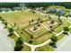 Aerial view of community neighborhood featuring a park area with walking trails and playgrounds at 701 Squire Pope Rd, Summerville, SC 29486