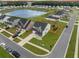 Beautiful aerial view of a neighborhood with a pond, community amenities, and well-maintained homes at 701 Squire Pope Rd, Summerville, SC 29486