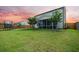 Spacious backyard features a screened-in porch, trampoline, and playset on a grassy lawn at 701 Squire Pope Rd, Summerville, SC 29486