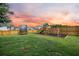 Spacious backyard with a wooden fence, a trampoline, and a playground with a swing set and slide at 701 Squire Pope Rd, Summerville, SC 29486