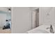 Bathroom featuring a white vanity with a sink and view into an adjacent bedroom with blue walls at 701 Squire Pope Rd, Summerville, SC 29486