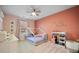 Charming bedroom featuring light pink walls, a white bed frame, and a custom wall decor at 701 Squire Pope Rd, Summerville, SC 29486