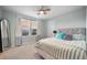 Comfortable bedroom with a large bed, neutral walls, and bright natural light from the window at 701 Squire Pope Rd, Summerville, SC 29486