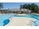 Community swimming pool features a splash pad and a covered picnic area with shade at 701 Squire Pope Rd, Summerville, SC 29486