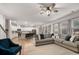 Open-concept living room and kitchen boasts hardwood floors and a modern design at 701 Squire Pope Rd, Summerville, SC 29486