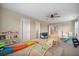 Bright playroom featuring a colorful playset, shelving with books, and a comfortable seating area at 701 Squire Pope Rd, Summerville, SC 29486