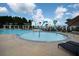 Community splash pool with water features, lounge seating, and white pergola accents at 701 Squire Pope Rd, Summerville, SC 29486