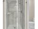 Bathroom featuring an enclosed walk-in shower with stylish white marble and modern fixtures at 7021 Schooner St, Charleston, SC 29492