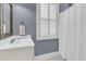 Cozy bathroom featuring a large vanity with shower and tub at 7021 Schooner St, Charleston, SC 29492