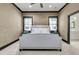 Serene bedroom with neutral walls, windows with views, and soft carpet at 7021 Schooner St, Charleston, SC 29492