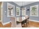 Dining room with modern chandelier and windows at 7021 Schooner St, Charleston, SC 29492