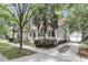 Charming home with a well-manicured lawn, inviting porch, and detached garage at 7021 Schooner St, Charleston, SC 29492