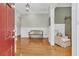 Welcoming foyer featuring hardwood floors, wainscoting, and a cozy bench at 7021 Schooner St, Charleston, SC 29492