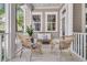 Inviting front porch featuring cozy seating, stylish decor, and a relaxing atmosphere at 7021 Schooner St, Charleston, SC 29492