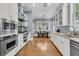 Bright kitchen with stainless steel appliances, and white cabinetry at 7021 Schooner St, Charleston, SC 29492