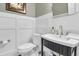 Elegant powder room featuring wainscoting and designer fixtures at 7021 Schooner St, Charleston, SC 29492