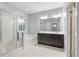 A luxurious bathroom featuring a walk-in shower, soaking tub, and double vanity at 705 Quintan St, Summerville, SC 29486