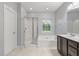 Bathroom features a walk-in shower, soaking tub, and dark-stained vanity at 705 Quintan St, Summerville, SC 29486