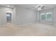 A bright bedroom with carpet flooring, a ceiling fan, and natural light streaming through windows at 705 Quintan St, Summerville, SC 29486
