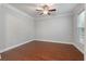 Cozy bedroom with wood floors, a ceiling fan, and a window that offers great natural light at 705 Quintan St, Summerville, SC 29486