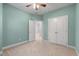 Neutral bedroom featuring plush carpet, ceiling fan, and a large closet for optimal storage at 705 Quintan St, Summerville, SC 29486