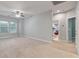 A well-lit bedroom with neutral walls, carpet, and an ensuite bathroom at 705 Quintan St, Summerville, SC 29486
