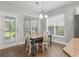 Bright breakfast nook featuring a dining table set with natural light at 705 Quintan St, Summerville, SC 29486