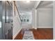 Welcoming foyer with hardwood floors, staircase, and an open view to a bright living space at 705 Quintan St, Summerville, SC 29486