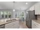 Eat-in kitchen featuring an island and stainless steel appliances with lots of natural light at 705 Quintan St, Summerville, SC 29486