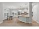 Eat-in kitchen featuring an island, stainless steel appliances, and a bright breakfast nook at 705 Quintan St, Summerville, SC 29486