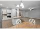 A modern kitchen features stainless steel appliances and an island with seating at 705 Quintan St, Summerville, SC 29486