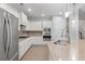 Modern kitchen with stainless steel appliances, light countertops, and ample cabinet space at 705 Quintan St, Summerville, SC 29486