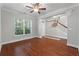 Bright living room featuring hardwood floors, a ceiling fan, and a staircase leading to the upper level at 705 Quintan St, Summerville, SC 29486