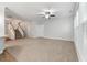 Living room featuring a staircase, neutral carpet, ceiling fan and natural light at 705 Quintan St, Summerville, SC 29486