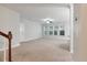 Living room showcasing neutral tones, large windows, ceiling fan, and easy access at 705 Quintan St, Summerville, SC 29486