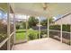 Screened in porch with a ceiling fan, and an amazing view of the green back yard at 705 Quintan St, Summerville, SC 29486